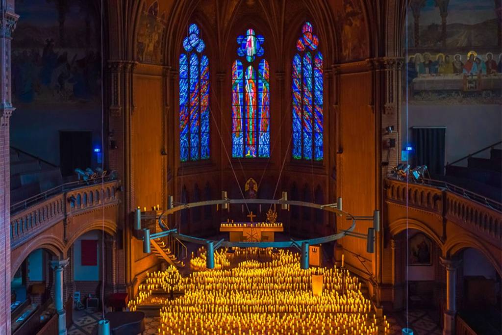 The Apostle Paul Church in Berlin glows by candlelight during a candlelight concert