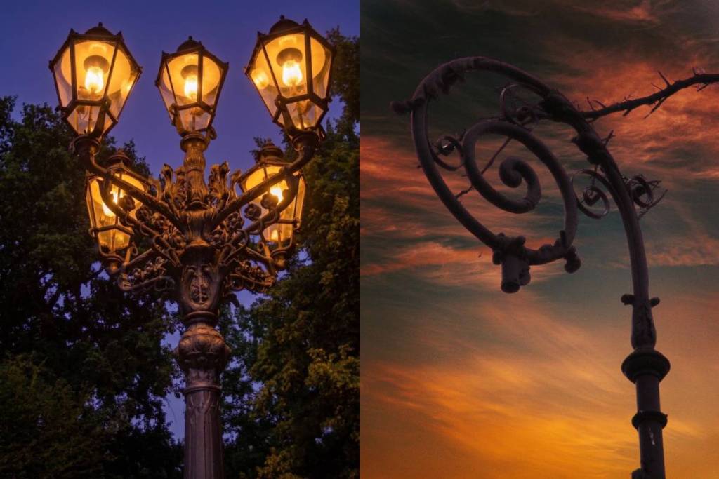 The contrast between two historic gas lanterns: a glowing, five-flame lantern and a curved pole at sunset at the Berlin Gas Lantern Open-Air Museum.