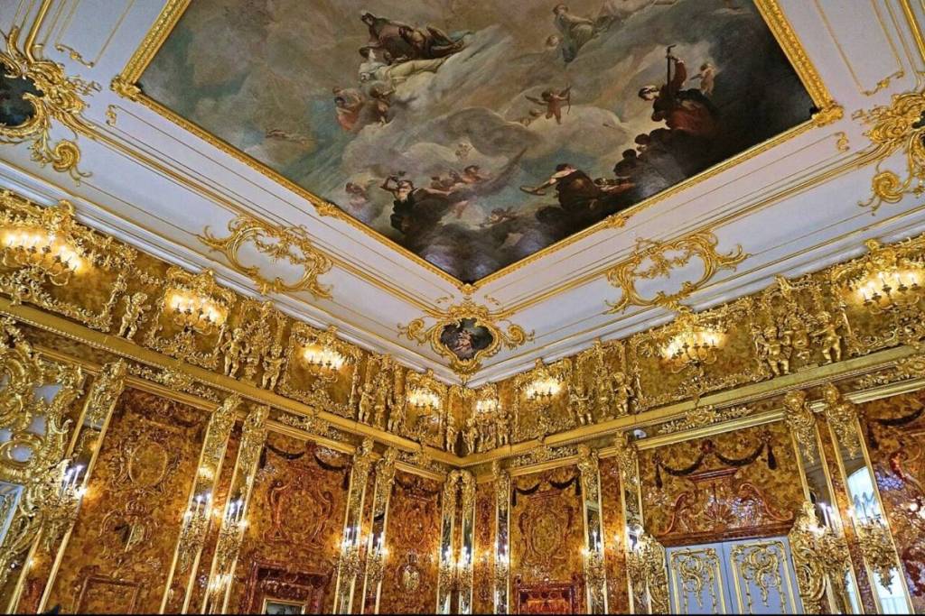 View of the magnificent hall, entirely paneled with amber, in the reconstruction of the Amber Room at the Catherine Palace, Russia.