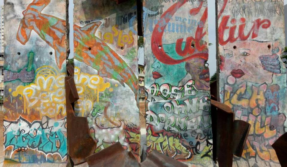 What happened to the approximately 90,000 concrete sections used to build the Berlin Wall?