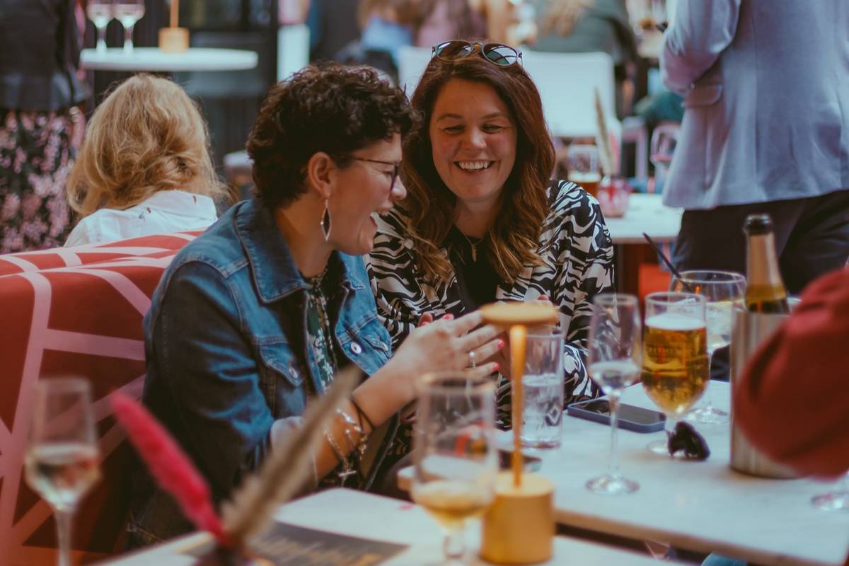 Two women drinking at Birmingham rooftop bars