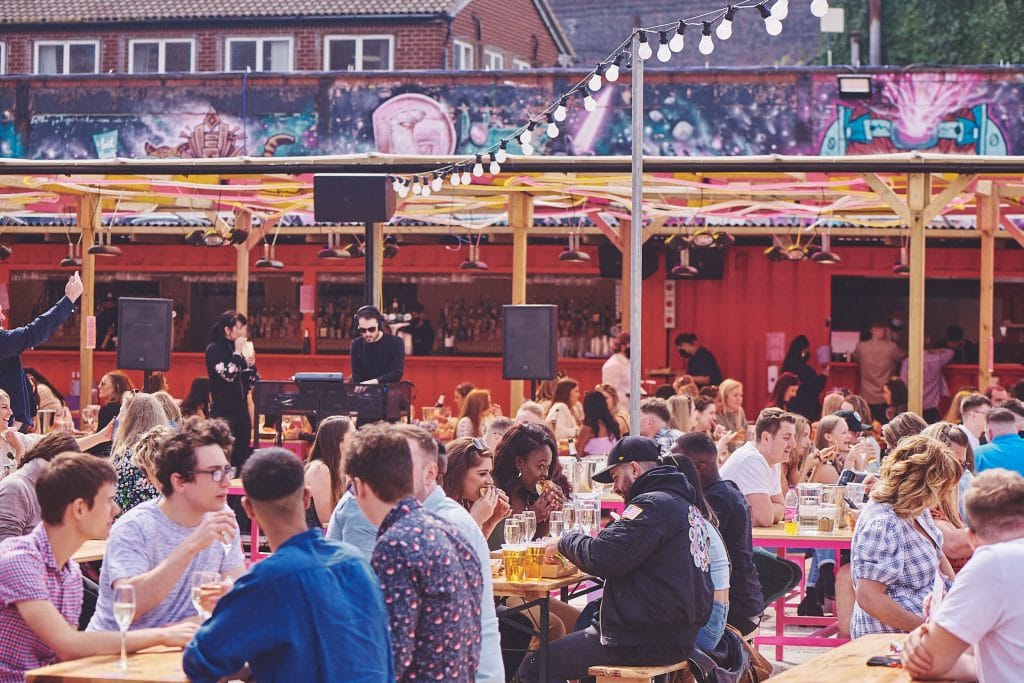 Crowds at tables outdoors