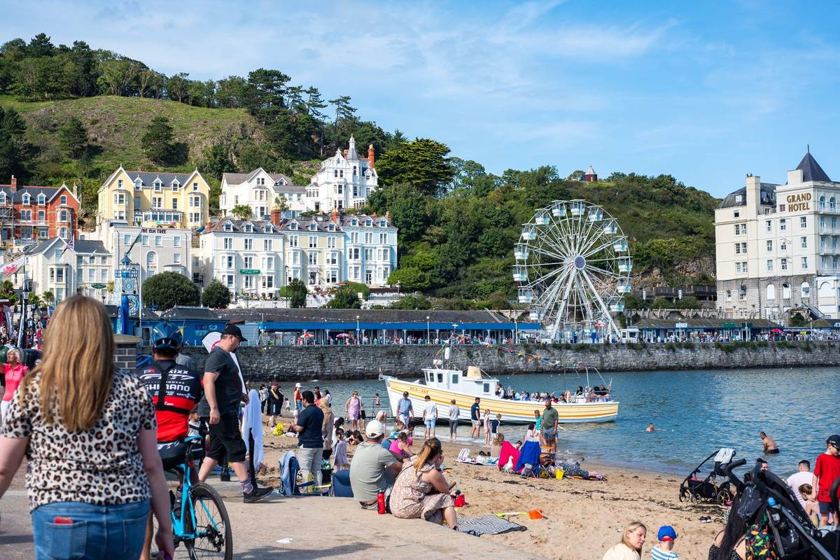 Llandudno, United Kingdom - September 3, 2023: A lot of people during beautiful Summer Day in Llandudno Sea Front in North Wales, United Kingdom, one of the best seaside towns near Birmingham