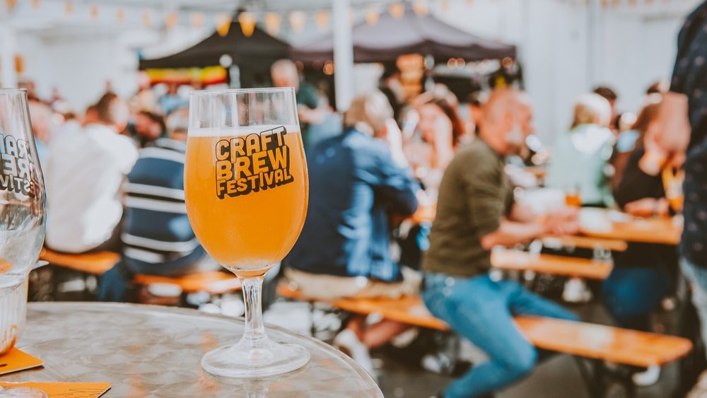 A pint glass with Craft Brew Festival branding
