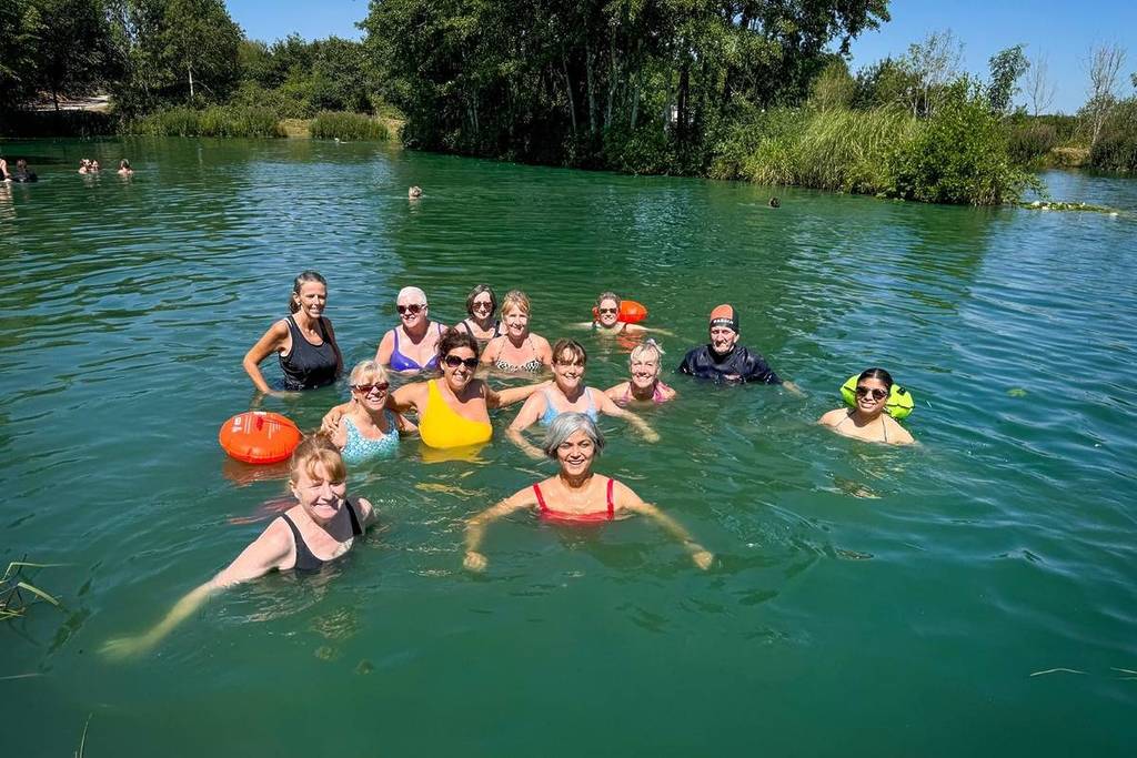 A group of people swimming at Lavender Hall Fishery
