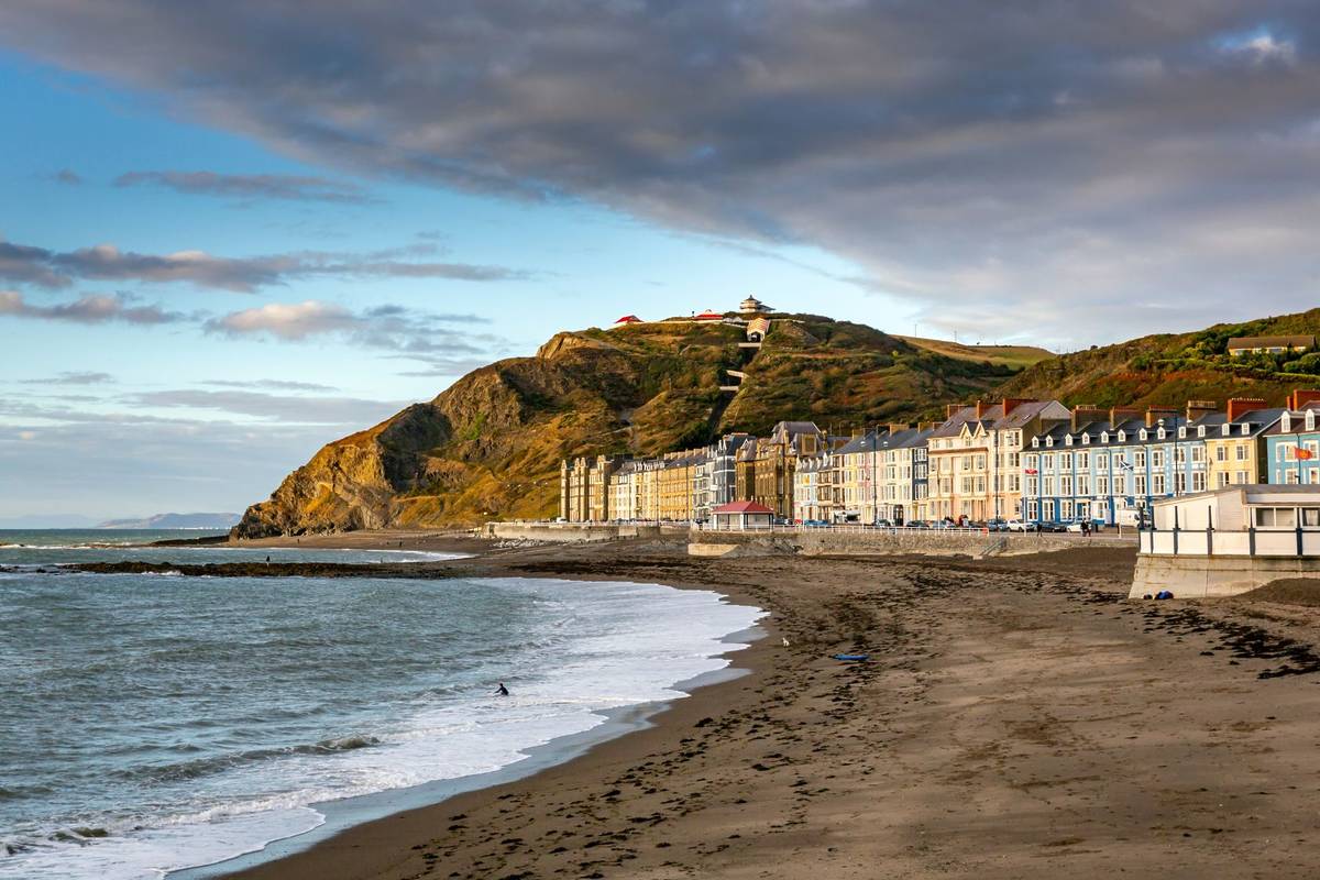 The North Beach and Seafront with its colourful buildings at Aberystwyth, West Wales.  One of the best seaside towns near Birmingham.