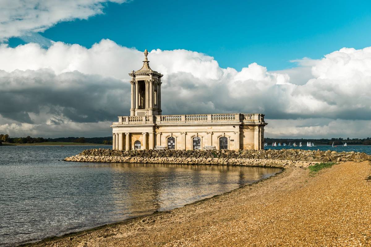 Rutland Water Beach, England. Normanton Church which is Rutland's most famous landmark