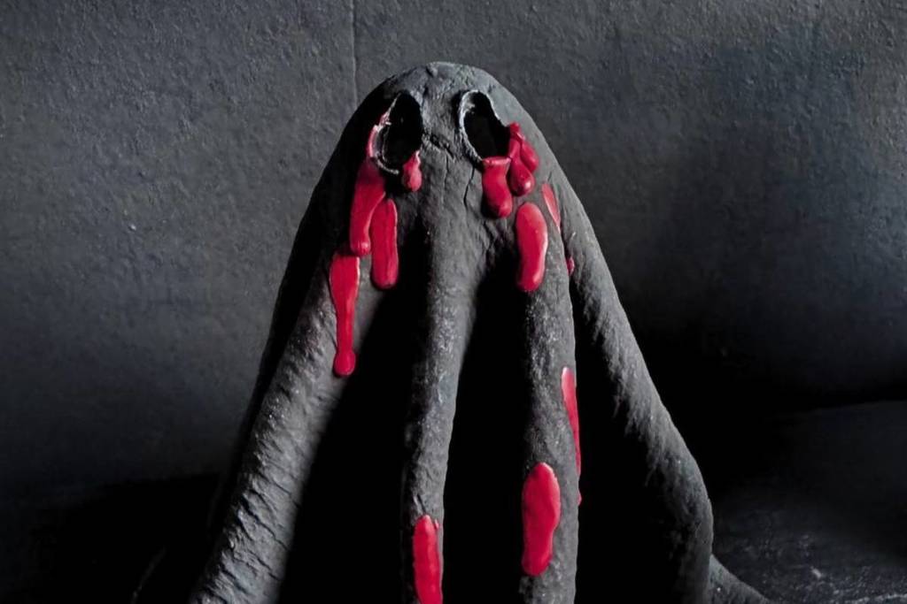 A ghost statue covered in blood