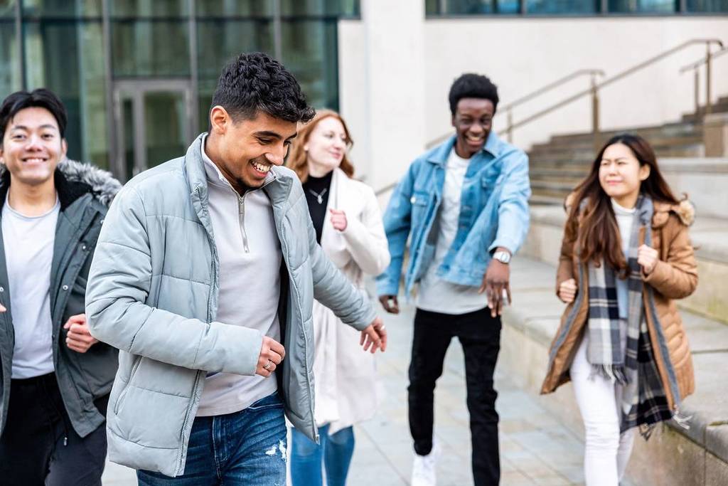 Friends running and enjoying time together at Birmingham university