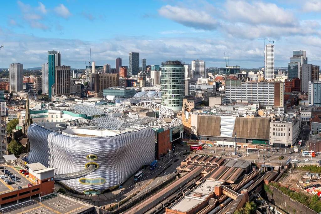 BIRMINGHAM, UK - SEPTEMBER 28, 2024. aerial view of a Birmingham cityscape skyline with the Bullring shopping centre and Selfridges building exterior in the city center with Moor Street train station