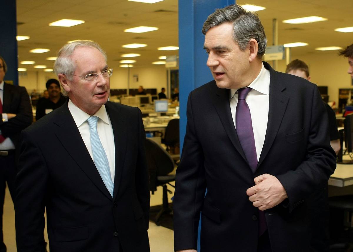BIRMINGHAM, ENGLAND - JANUARY 09: Prime Minister Gordon Brown chats Sir Peter Rigby (L), owner of software company SCC. on January 9, 2009 in Birmingham, England. The Prime Minister is on the third day of his regional tour of England and Wales to explain what the government is doing to help the country through the economic downturn. (Photo by Christopher Furlong/Getty Images)