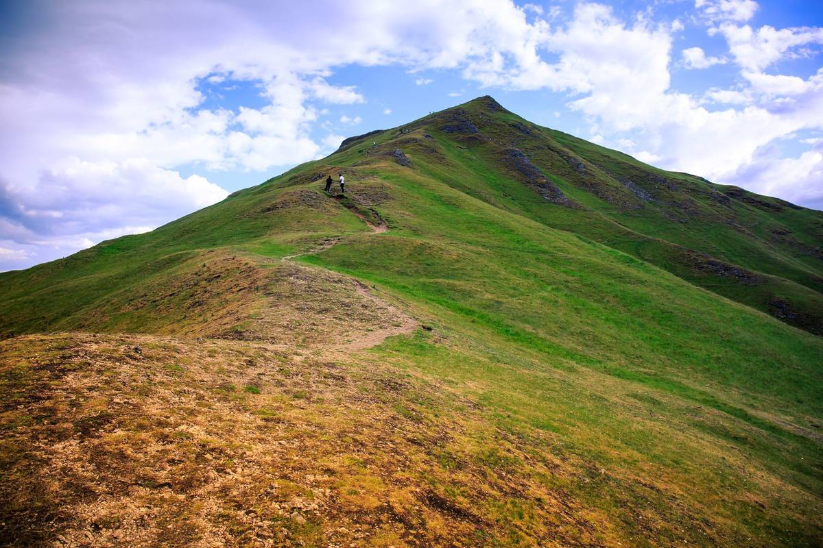 People climbing a hill, possibly Thorpe Cloud, in Dovedale