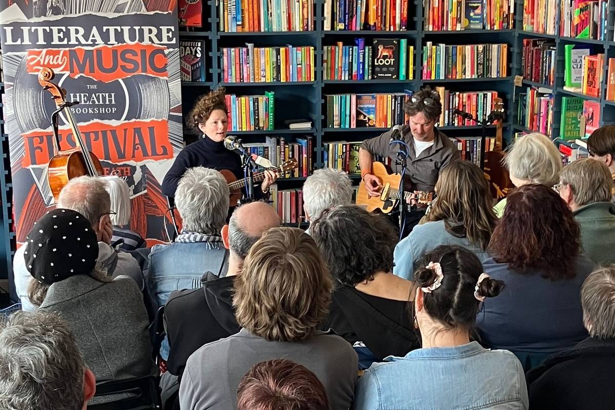 An audience watching musicians at The Heath Bookshop Literature And Music Festival