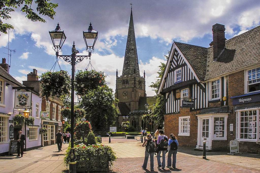 SOLIHULL WEST MIDLANDS UK â?? SEPTEMBER 26 2016: Town centre of Solihull. Sunny afternoon in late September and there are people walking around the streets and pedestrianised squares of the town.