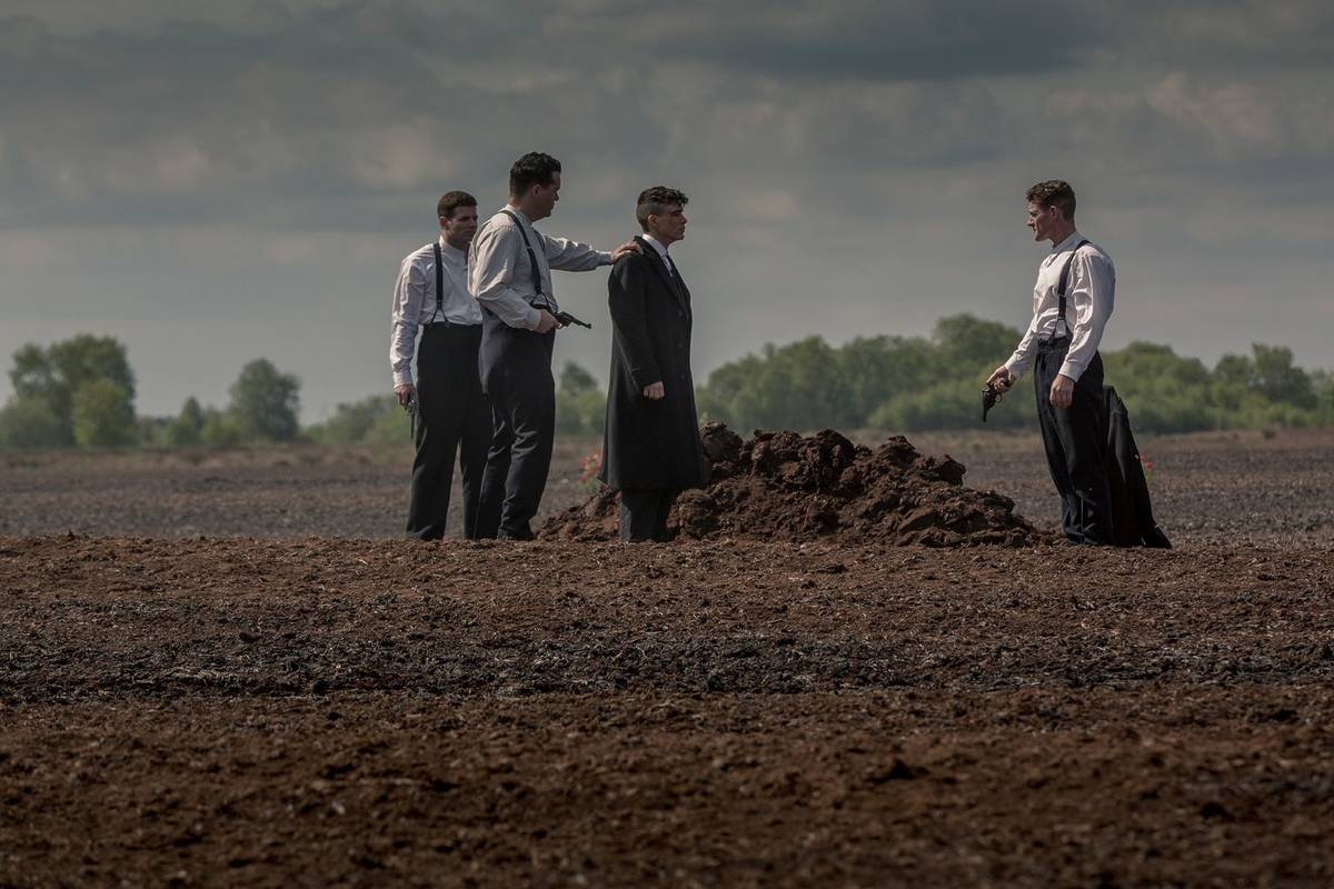 Tommy in a field with three Ulster volunteers