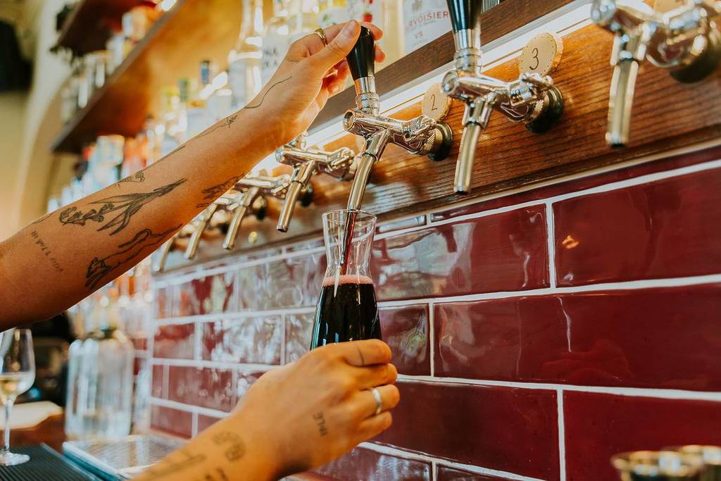Pints being poured at 1000 Trades On The Park