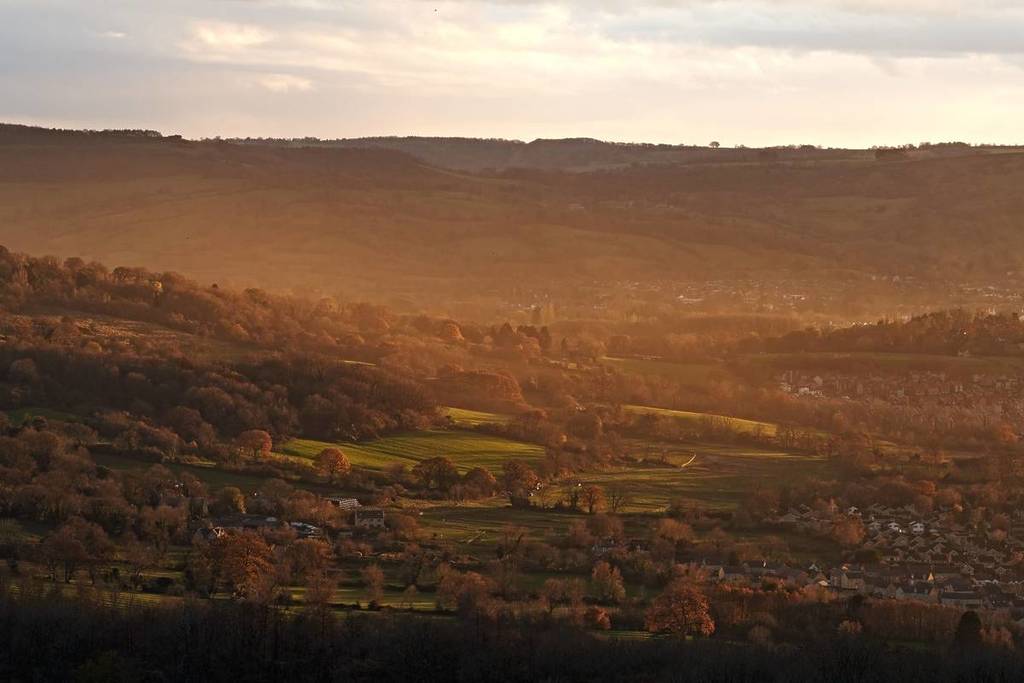 Beautiful soft gold light hitting Cheltenham at sunset 

