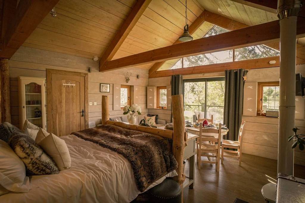 Orchard Treehouse interior with bed
