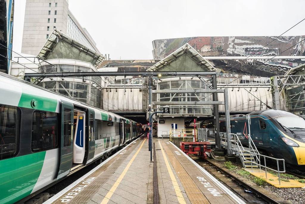 Birmingham, England, November 4th 2023. Birmingham New Street station with modern trains side by side on adjacent tracks.