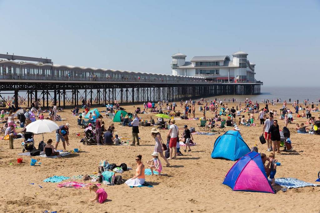 WESTON-SUPER-MARE, SOMERSET-MAY 7th 2018: Beautiful sunshine and warm weather drew visitors to the coast for the bank holiday weekend at Weston-super-Mare, Somerset on Monday 7th May 2018