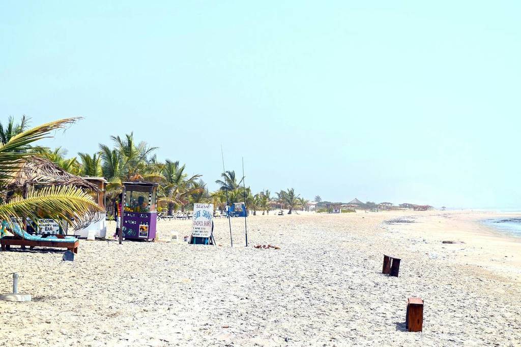 A sandy beach with a few chairs and umbrellas
Paradise Beach, Sanyang in The Gambia