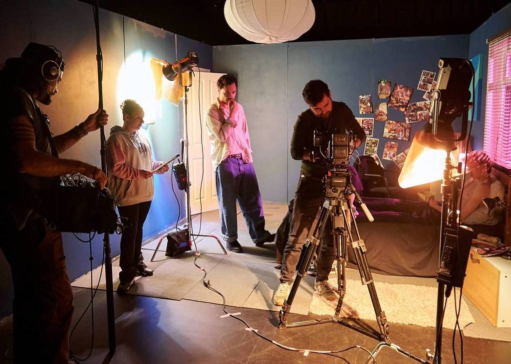 A film crew with cameras filming
