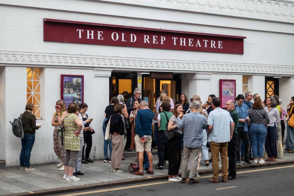 A crowd outside of the Old Rep Thetre