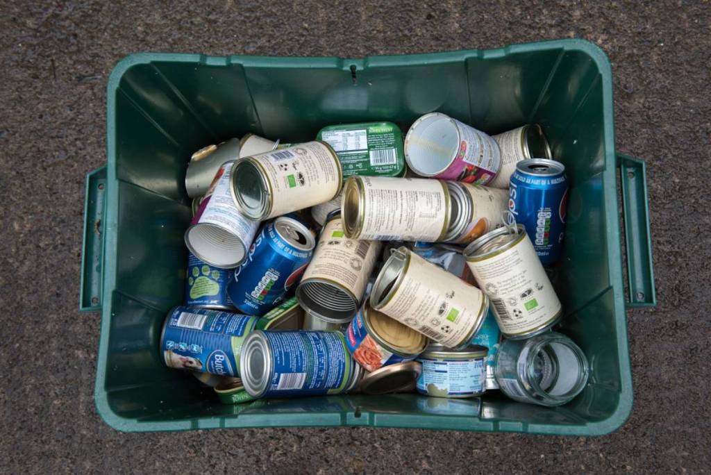 Bristol, UK - September 13, 2016: a domestic recycling bin full of various cans and tins.