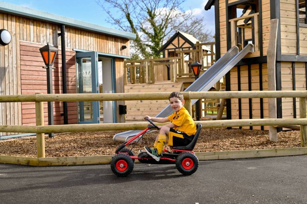 A child on a pedal go-kart at Hockerhill Adventure Playbarn