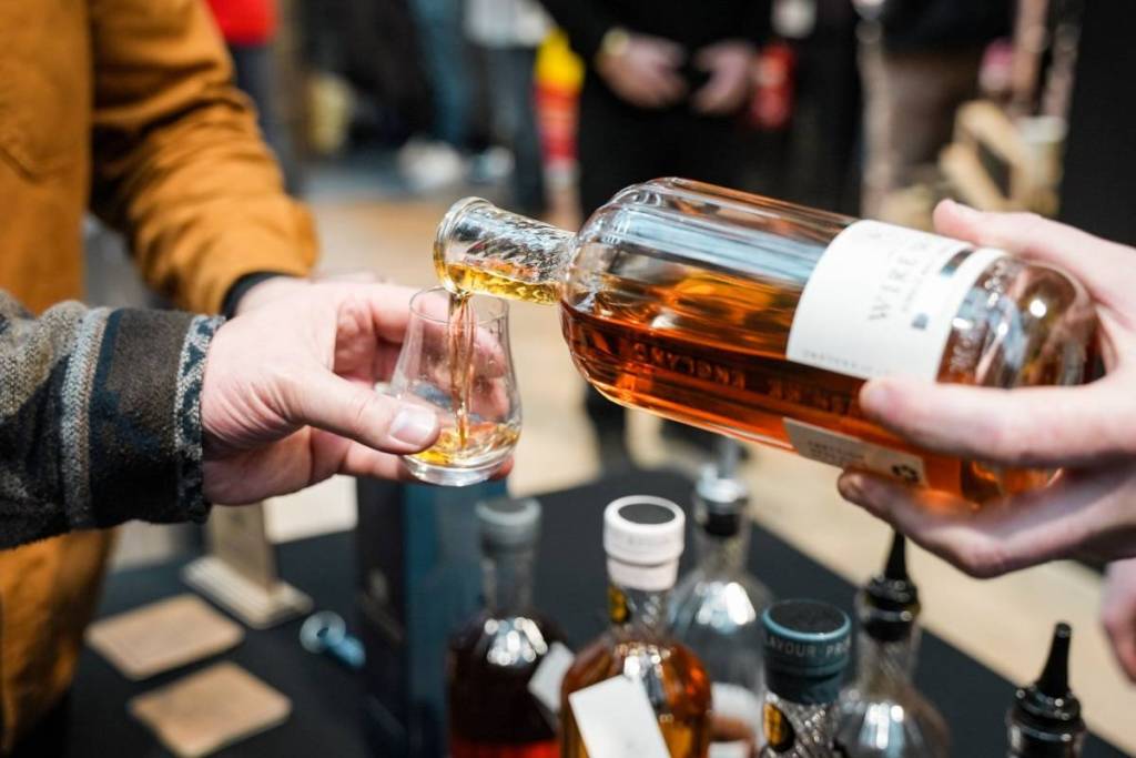 Pouring whisky at the English Whisky Festival