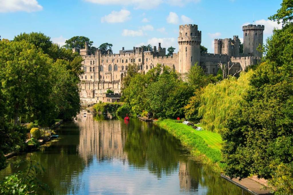 Warwick castle from outside. It is a medieval castle built in 11th century and a major touristic attraction in UK nowadays. Sunny day