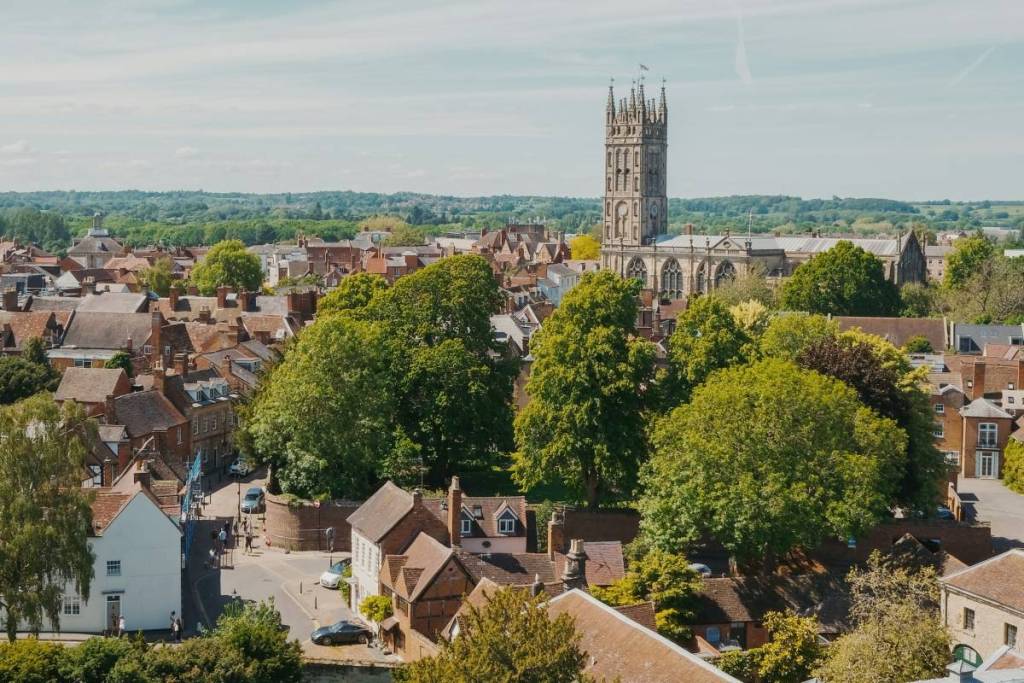 A viewpoint overlooking the town with a medieval church in Warwick, UK

