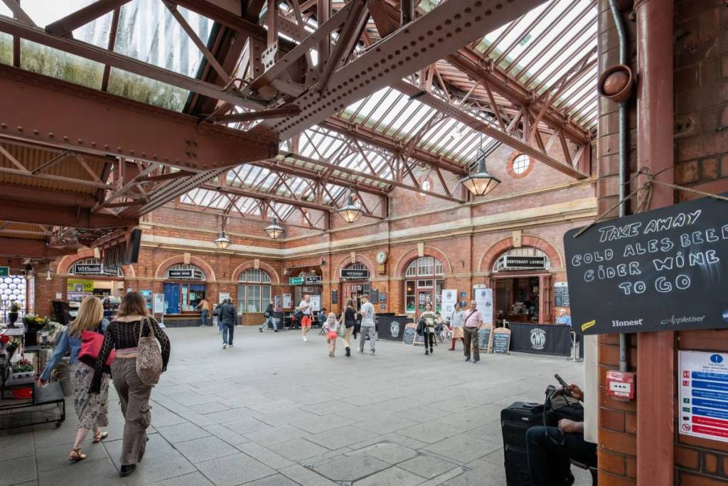 Birmingham Moor Street Railway Station booking hall interior with passengers in Birmingahm, West Midlands, UK on 23 July 2023
