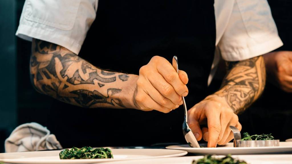 A chef plating food