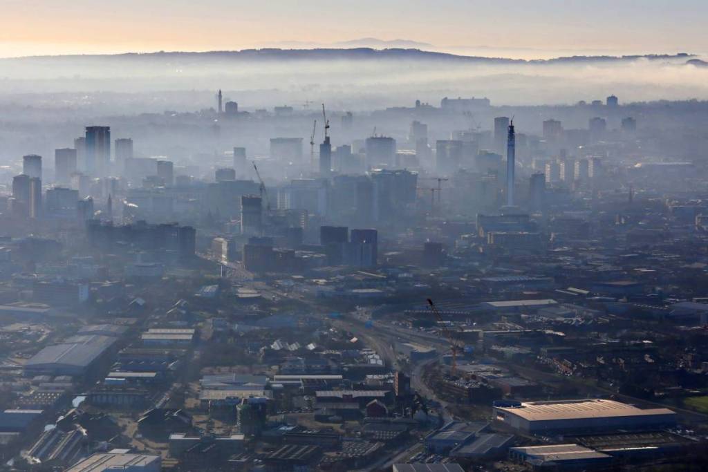 aerial view of a misty Birmingham skyline, UK