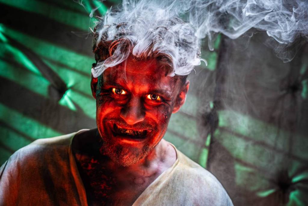 A demon man with a smoking head at Screamfest