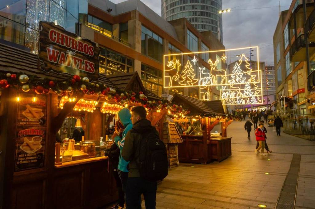 Birmingham, UK - December 2, 2019: People shop at stalls at the Birmingham Frankfurt Christmas Market.