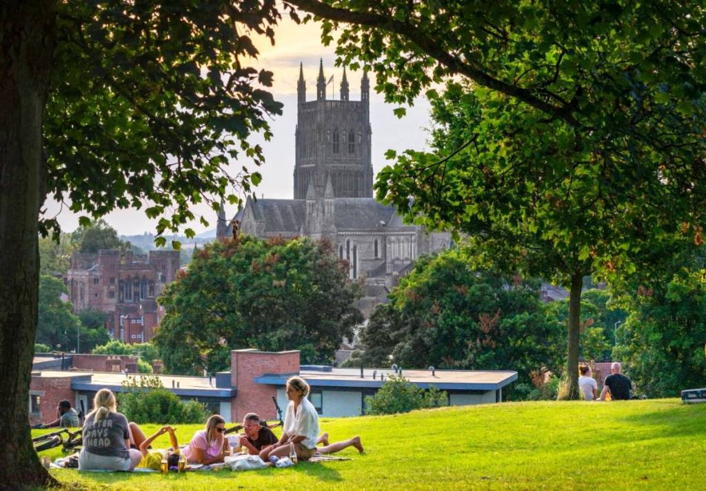 Worcestershire,UK-July 30 2024: People climb the hill to chill out in the late afternoon sun,at the site of the Battle of Worcester,the final scene of the English Civil War,fought in 1651.