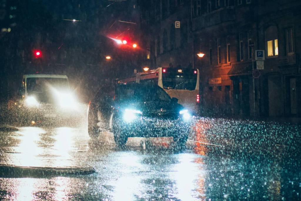 A car driving in the rain