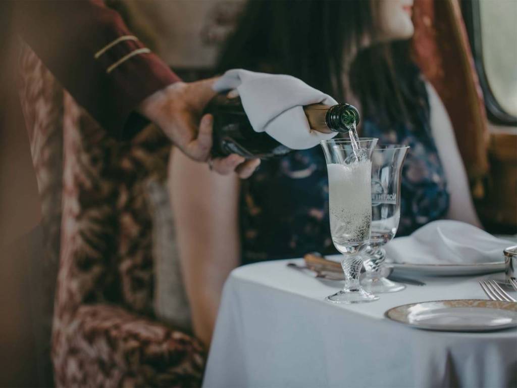 Pouring champagne on the Northern Belle