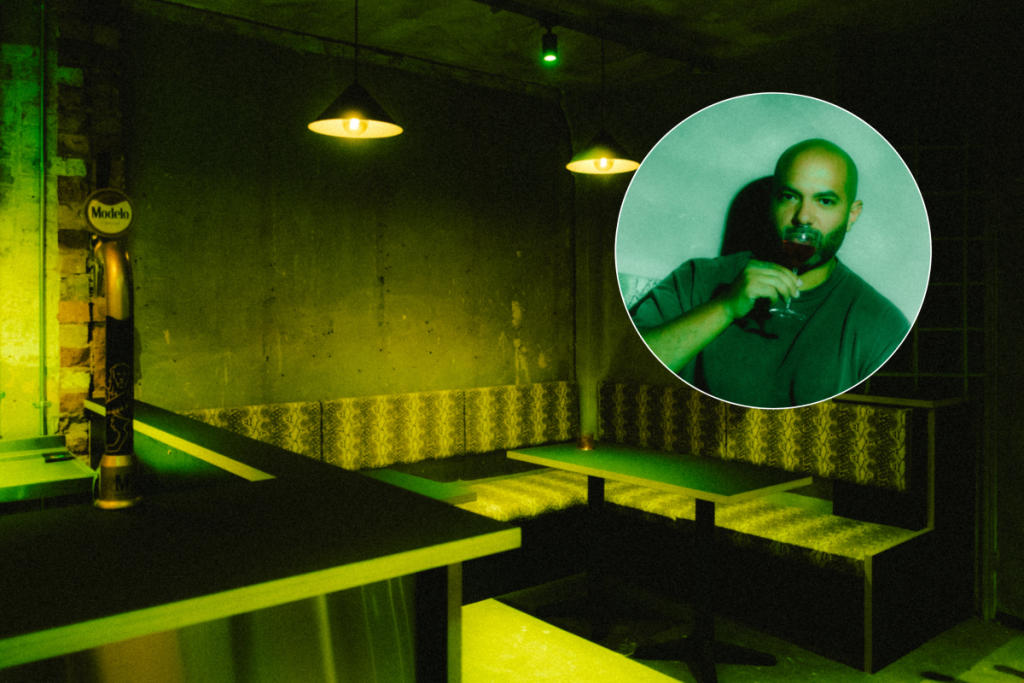 Snake Oil green interior with Matt Wilden drinking a cocktail