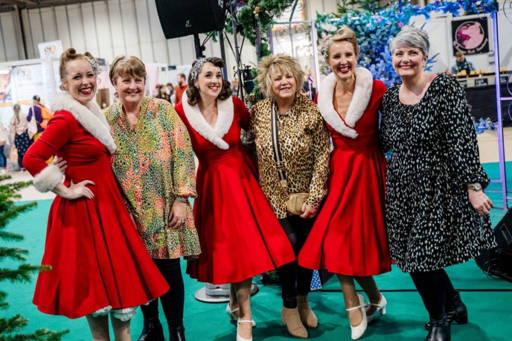 Women dressed up for Christmas at Good Food Show