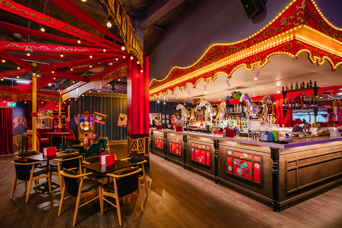 a photo of a vibrant circus-themed bar