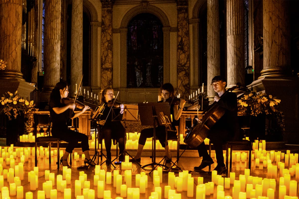 A string quartet performing inside a Cathedral at a Candlelgiht concert