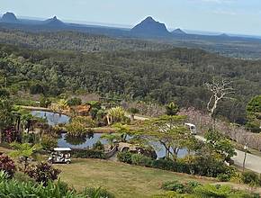Only 100km from Brisbane: This cool mountain town features 5 walk-through aviaries, a 23-acre botanic garden, artisanal cheese tasting trails, and more