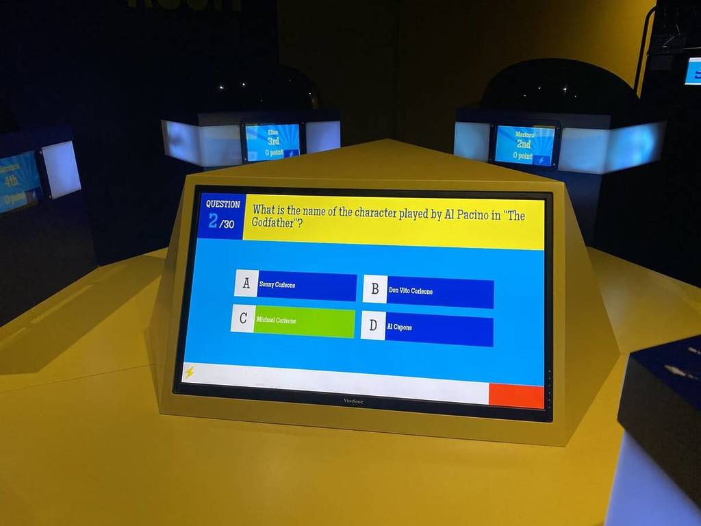 A close up shot of a question on screen at Quiz Room.