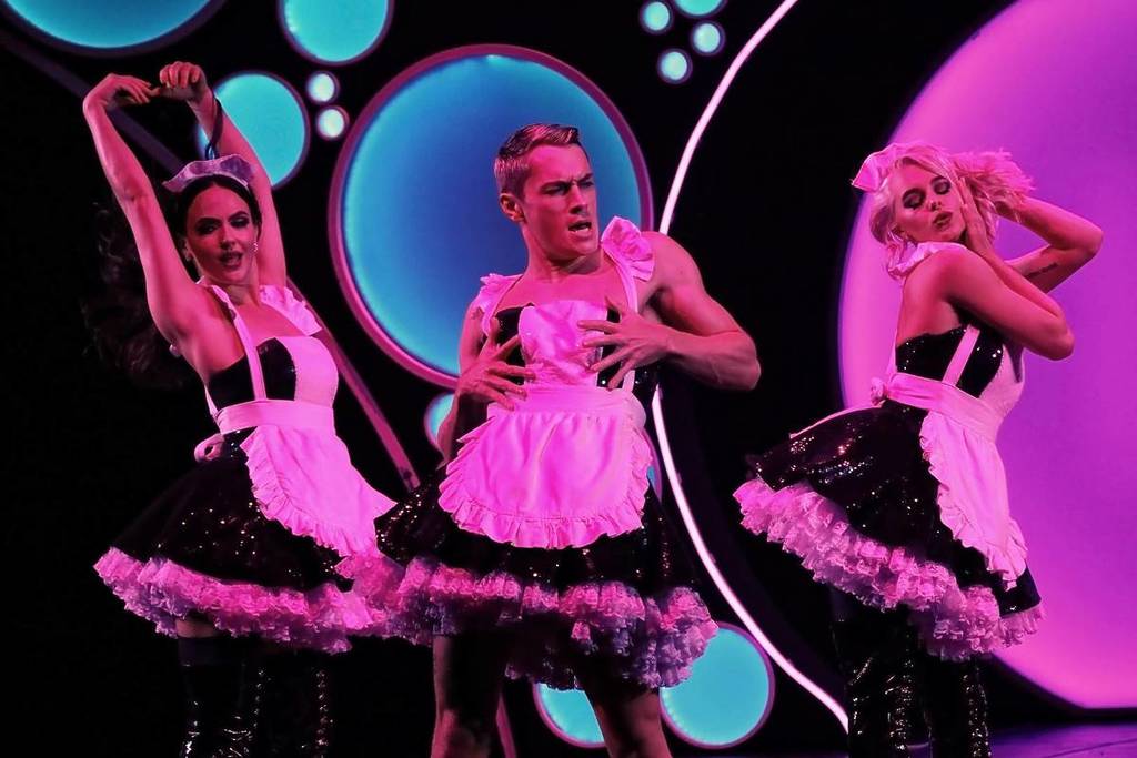 A group of dancers cheekily dressed as french maids