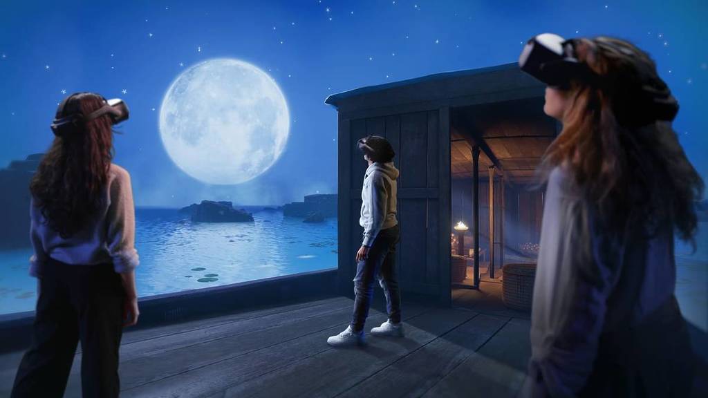 Three people in VR headsets appear to be standing on a boat in Egypt, staring up at the moon, at Horizon of Khufu.