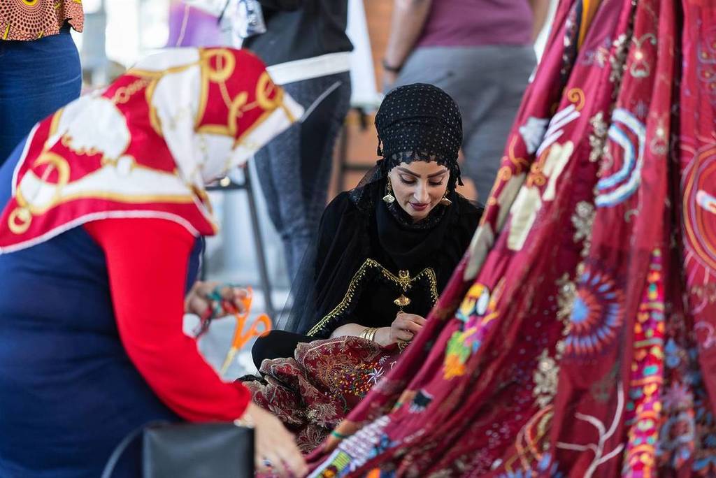 the red dress making of embroiderers