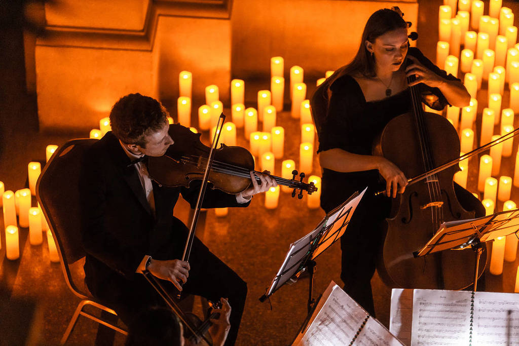 Thousands of flickering candles are illuminating St Mary Redcliffe Church this summer — with live string quartets and pianists